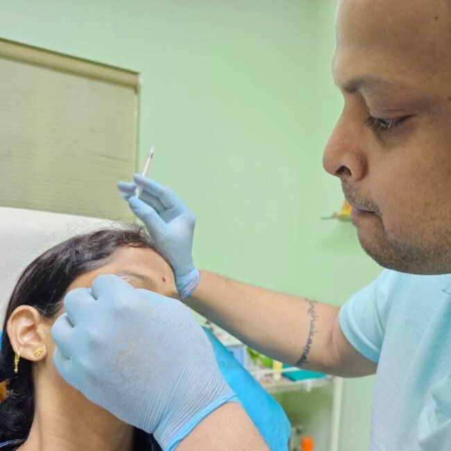 "Doctor administering Botox treatment to a woman in her clinic in Bhubaneswar, highlighting a professional and caring environment."