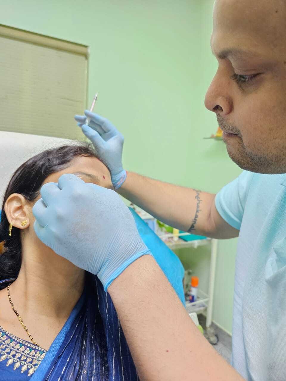 "Doctor administering Botox treatment to a woman in her clinic in Bhubaneswar, highlighting a professional and caring environment."